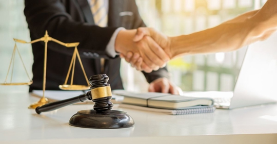 lawyer handshake with the client